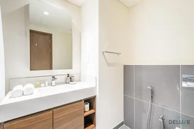 a bathroom with a sink and a shower at Charming 1BR Apartment in Creek Edge Tower 1, Dubai Creek Harbor by Deluxe Holiday Homes in Dubai