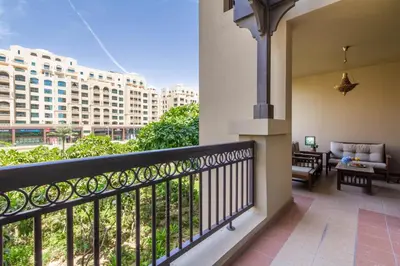 a balcony with a view of a building at Bespoke Holiday Homes - Palm Jumeirah- 1 Bedroom North Residence in Dubai