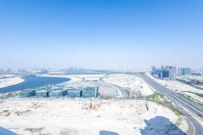 an aerial view of a construction site with a city at Dubai Dreaming Stylish 1BR, DAMAC Towers Paramount in Dubai
