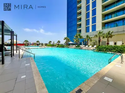 a swimming pool in the middle of a building at Mira Holiday Homes - Fully Furnished Studio in Business Bay in Dubai