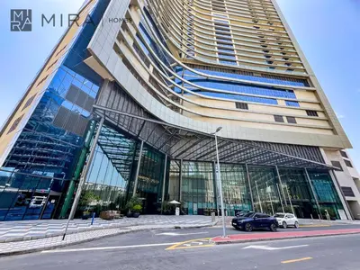 a large building with a car parked in front of it at Mira Holiday Homes - Fully Furnished Studio in Business Bay in Dubai