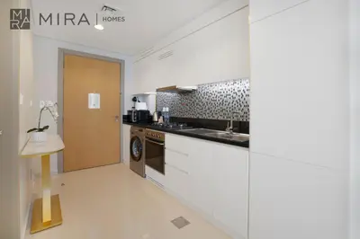 a kitchen with a sink and a counter top at Mira Holiday Homes - Fully Furnished Studio in Business Bay in Dubai