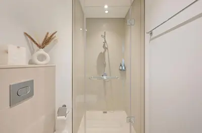 a shower with a glass door in a bathroom at Apartment in Downtown Dubai (Burj Khalifa Views) in Dubai