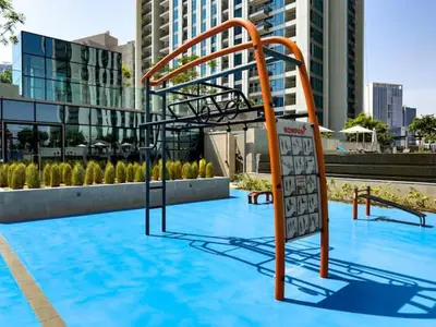 an empty swimming pool with a metal stairway in a building at Apartment in Downtown Dubai (Burj Khalifa Views) in Dubai