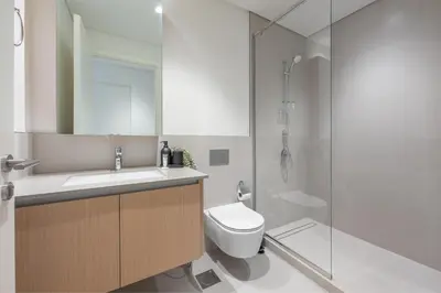 a bathroom with a sink and a toilet and a shower at HAVN - 1 Bedroom in Bayshore 2, Creek Beach in Dubai