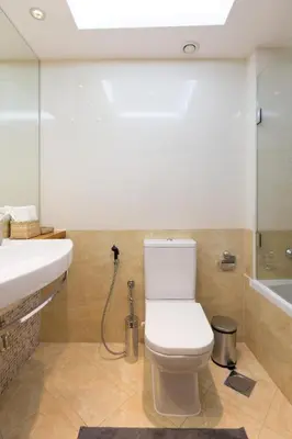 a bathroom with a toilet and a sink and a shower at JBR Walk Full Apartment Marina View in Dubai