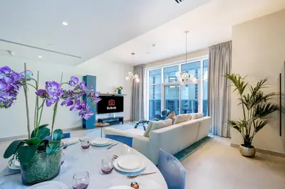 a living room with a couch and a table at 2BR in Central Marina Walk to Dining & Nightlife in Dubai