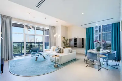 a living room with a couch and a table at 2BR in Central Marina Walk to Dining & Nightlife in Dubai