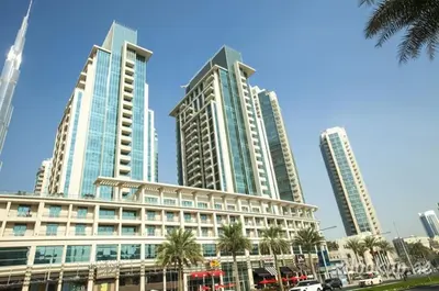 a group of tall buildings in a city at HAVN - Studio in Boulevard Central, Downtown Dubai in Dubai