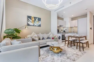 a living room with a couch and a table at STAY BY LATINEM Luxury 1BR Holiday Home CVR A2003 near Burj Khalifa in Dubai