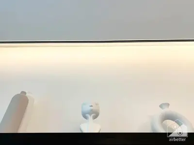 a glass window with two figurines in it at Modern 1-Bedroom Haven in Ahad Residence in Dubai
