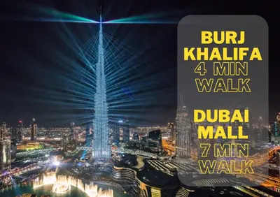 a view of a lit up city at night at New Modern Apartment 1BHK 5 min walk to Dubai Mall 99walk score in Dubai