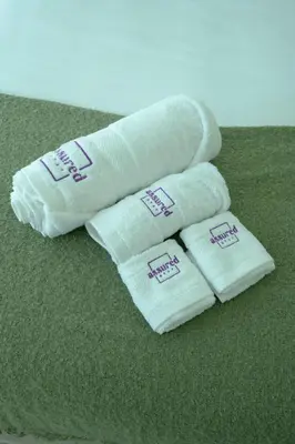 two towels sitting on top of a green carpet at Brand New 2BHK Luxury Apartment 7min to Dubai Mall 1.5 Bath in Dubai