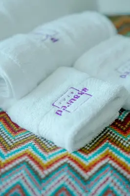 a stack of towels sitting on top of a rug at Brand New 2BHK Luxury Apartment 7min to Dubai Mall 1.5 Bath in Dubai