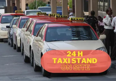 a row of taxi cars parked in a parking lot at Brand New 2BHK Luxury Apartment 7min to Dubai Mall 1.5 Bath in Dubai