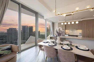 a kitchen and dining room with a table and chairs at Stella Maris - Beachfront Premium 3 Bedroom Apt in Dubai
