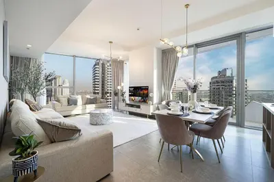 a living room with a couch and a table at Stella Maris - Beachfront Premium 3 Bedroom Apt in Dubai