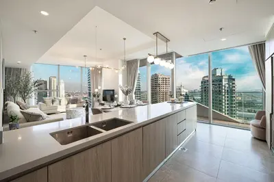 a kitchen with a large view of a city at Stella Maris - Beachfront Premium 3 Bedroom Apt in Dubai