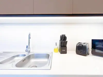 a kitchen counter with a sink and a toaster at Luxury & Elegance at Burj Crown Downtown in Dubai