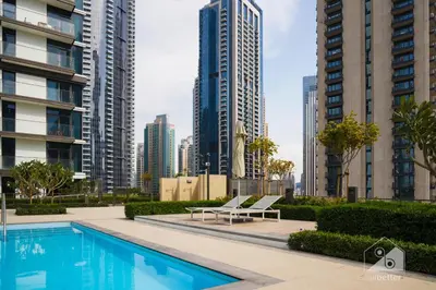 a swimming pool in a city with tall buildings at Luxury & Elegance at Burj Crown Downtown in Dubai