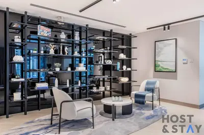 a store with blue and black shelving at Boutique Studio in Wilton Park MBR City in Dubai