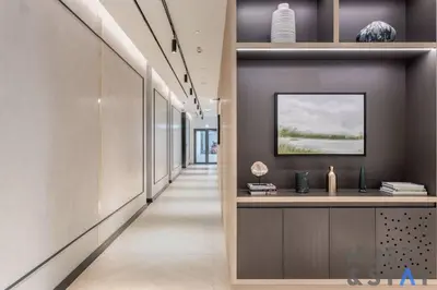 a hallway in a building with a tv on a wall at Boutique Studio in Wilton Park MBR City in Dubai