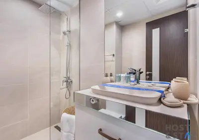 a bathroom with a sink and a shower at Upgraded Studio in Business Bay in Dubai
