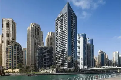 a city skyline with tall buildings and a river at Elegant studio in Sparkle Tower by Suiteable in Dubai