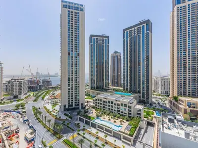 an aerial view of a city with tall buildings at The Harbor Heights 1BR in Palace Residences Creek in Dubai