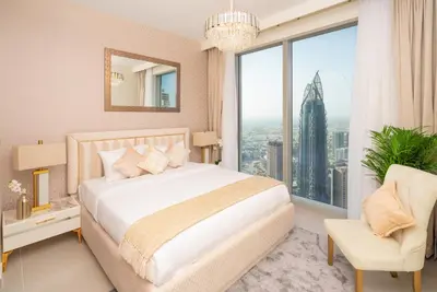 a bedroom with a bed and a large window at Elite Royal Apartment - Panoramic with Burj Khalifa & Full Fountain View - High Floor - Patron in Dubai