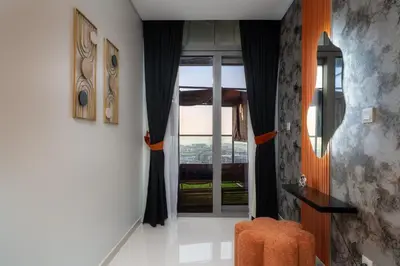 a hallway with a door leading to a room at 64th-Floor Rooftop Pool with Burj Khalifa View, 2BR Apartment in Paramount Hotel Midtown in Dubai