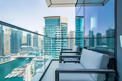 a balcony with a view of a city skyline at Chic 1BR in VIDA Residences Dubai Marina by Deluxe Holiday Homes in Dubai