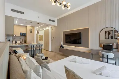 a living room with a couch and a table at Marina Seaside Living prime location by the beach in Dubai
