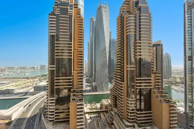 a group of tall buildings in a city at Marina Seaside Living prime location by the beach in Dubai
