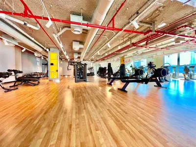 a gym with treadmills and exercise equipment in a room at Downtown Views 2BR - Dubai Mall, Fountain & Burj Khalifa access in Dubai