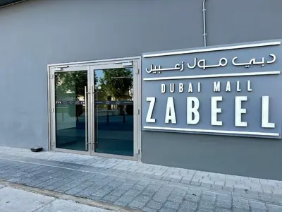 a sign on the side of a building at Downtown Views 2BR - Dubai Mall, Fountain & Burj Khalifa access in Dubai