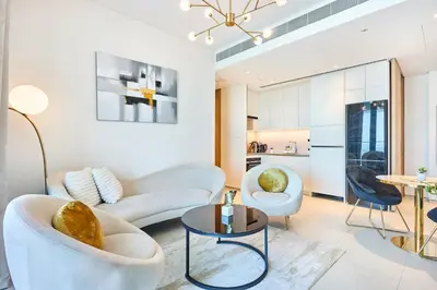 a living room with a couch and a table at Beachfront 1BR Retreat at Address JBR in Dubai