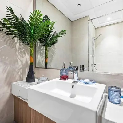 a bathroom with a white sink and a mirror at Azizi Riviera 16 studio with Kitchenet - Ideal for monthly in Dubai