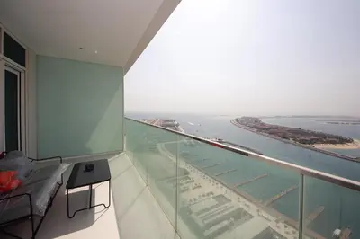 a room with a view of the ocean from a building at Incredible Sea view 2BHK - Private beach Access - Emaar Beachfront in Dubai