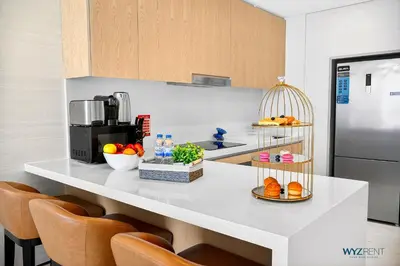 a kitchen with a counter with some food on it at Breathtaking 1BR in Palm Tower, with Sea View in Dubai