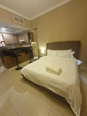 a hotel room with a bed and a piano at Dubai Downtown Dubai Mall & Burj Khalifa DIFC 5 mins in Dubai