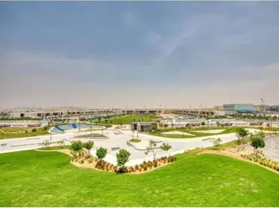 an overhead view of a park with a skate park at Lively 1 BR in Damac Hills, Dubai - Host & Stay in Dubai