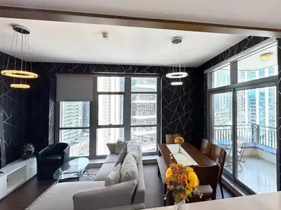 a living room with a couch and a table at Claren Tower 2 - Downtown by Golden Casa in Dubai