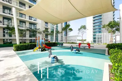 a playground in a building with a sign that reads luxury holiday at LUX The Marina Vista Beachfront Suite 2 in Dubai
