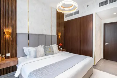 a bedroom with a large white bed in a room at GLOBALSTAY Creek Edge Tower Elegant Apartments in Dubai