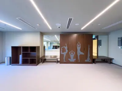a large room with a wooden door with graphics on it at GLOBALSTAY Creek Edge Tower Elegant Apartments in Dubai