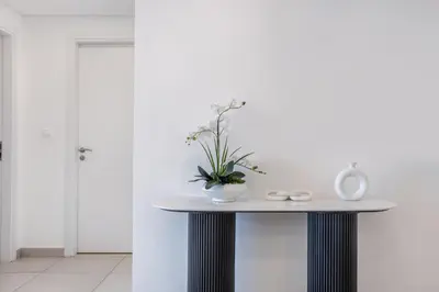 a table with a plant on it in a room at One Bedroom Apartment in Madinat Jumeirah Living by The S Holiday Homes in Dubai