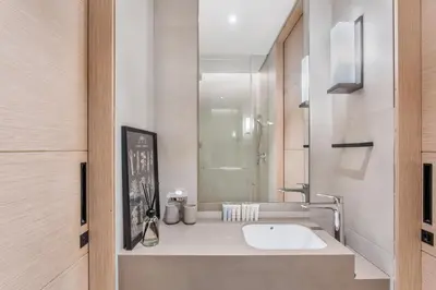a bathroom with a sink and a mirror at Family Sky Retreat at Address Beach on 56th Floor in Dubai