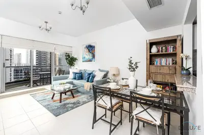 a living room with a couch and a table at Charming 1BR in The Point Tower, Dubai Marina by Deluxe Holiday Homes in Dubai