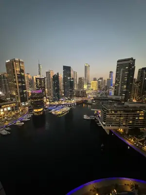 a view of a city with a river and buildings at Wonderful 1BR Apt with Marina view in Dubai